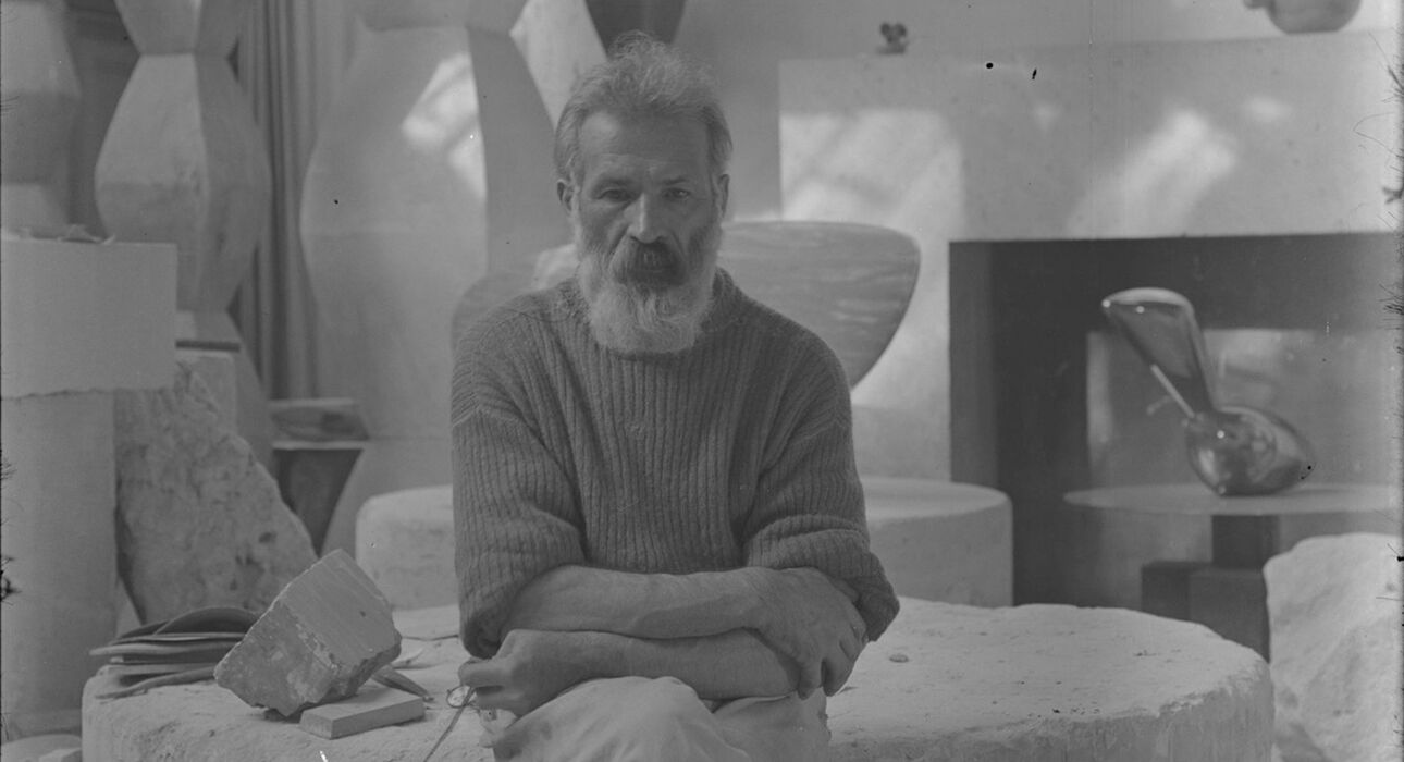 Constantin Brancusi. Self-portrait in the studio with Endless Columns I–IV, Fish (1930), Leda (1926). c. 1934. Glass negative, 5 7/8 × 3 15/16